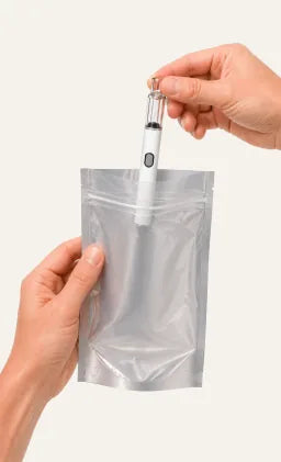 Placing Briar glass all-in-one vape hardware into a plain Mylar bag for a 50-pack reorder